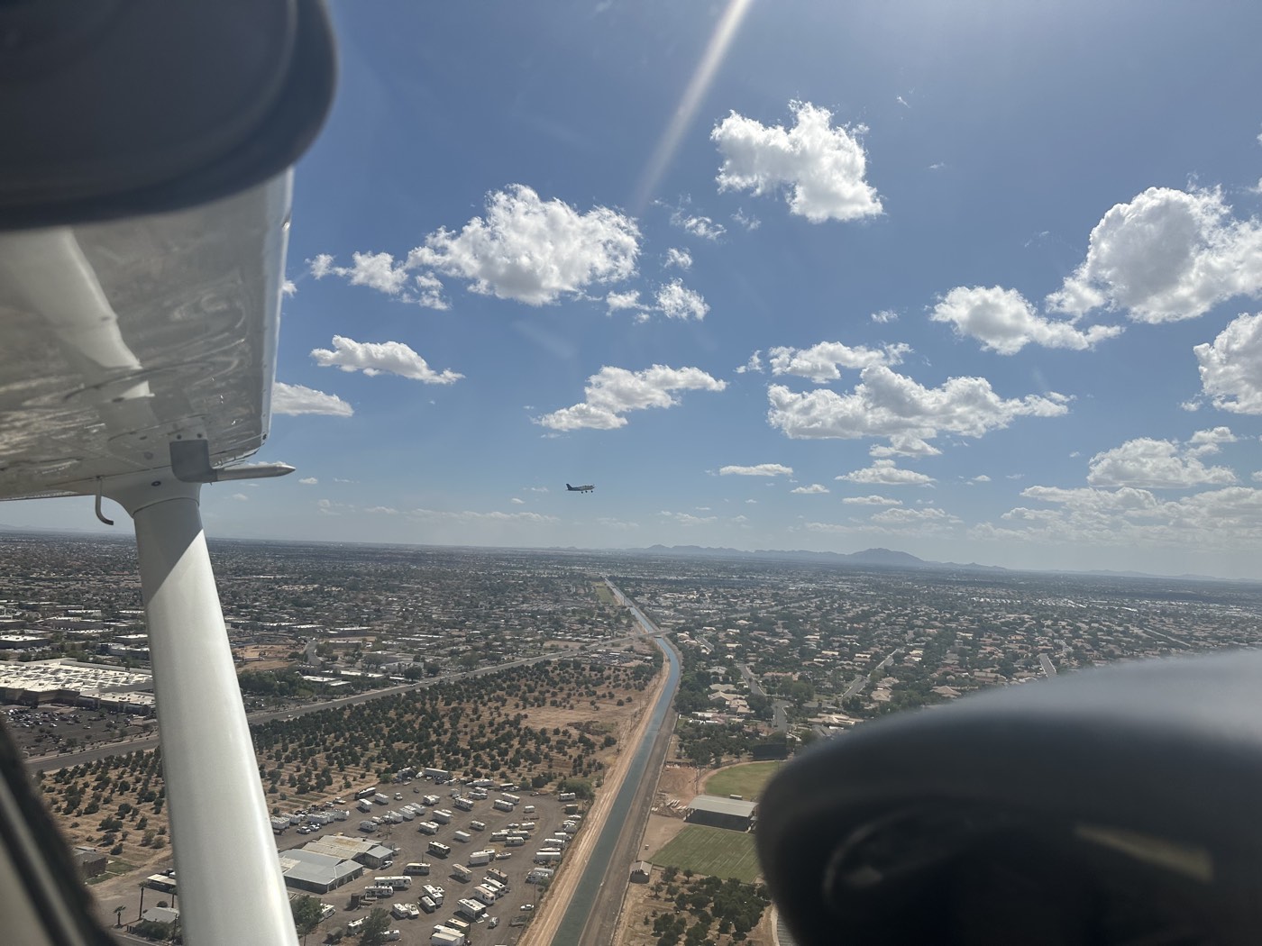 En route in a Cessna with another aircraft in sight over the Phoenix valley